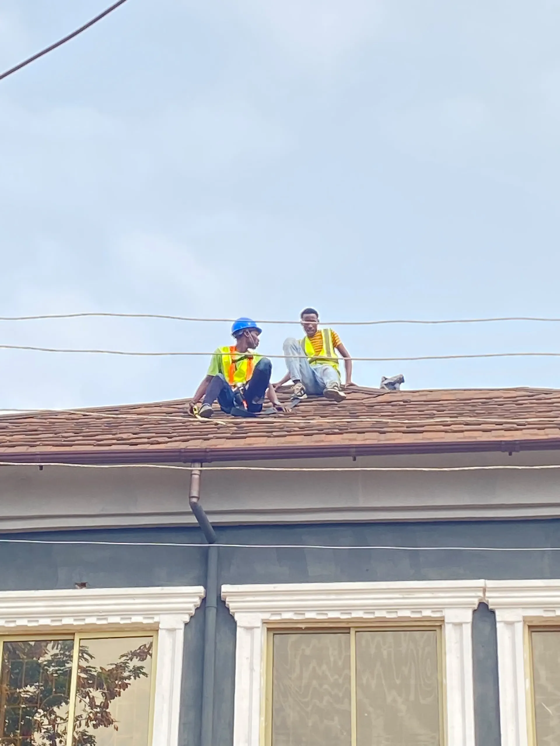 The crew fitting solar panels across the supermarket's pitched roof.