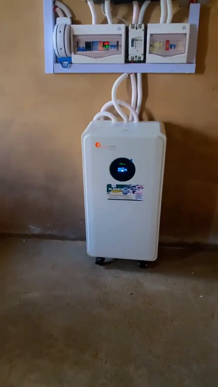 A close look at the installed hybrid inverter and battery at the farm.